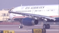 American, US Airways reach merger settlement with DOJ