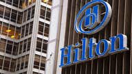 Hilton begins trading on the NYSE