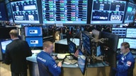 Dow breaks through 18K for first time