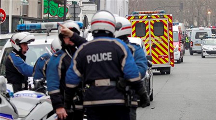 Paris on lockdown as manhunt for terror suspects continues