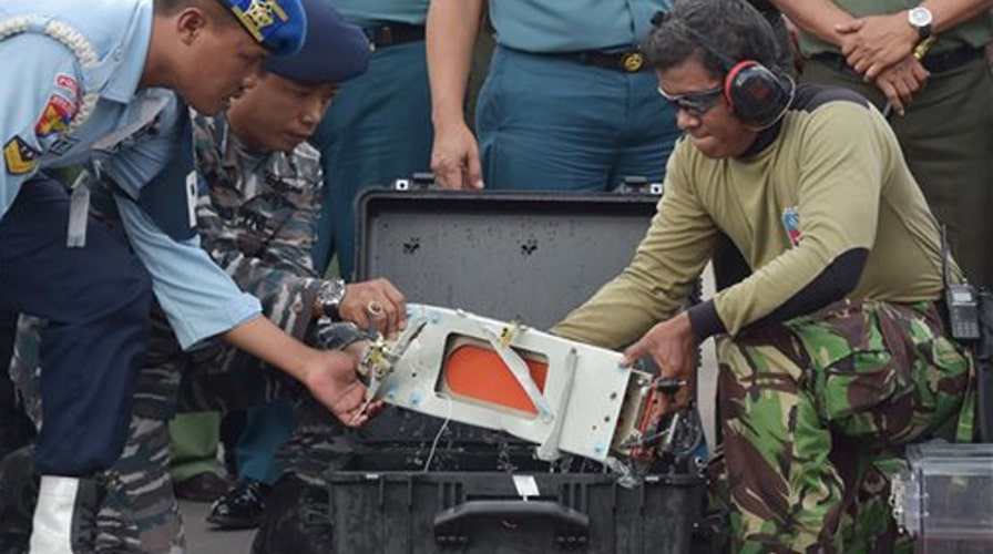 Divers locate the black boxes from AirAsia flight 8501