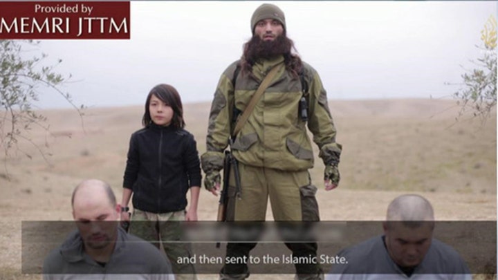 New ISIS video shows young boy executing prisoners