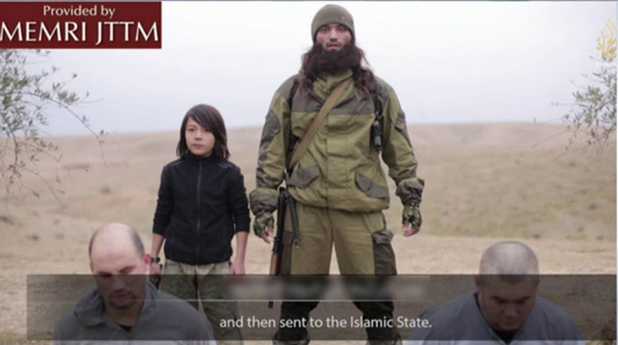 New ISIS video shows young boy executing prisoners