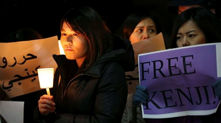 Crowds in Jordan, Japan call for hostages' release