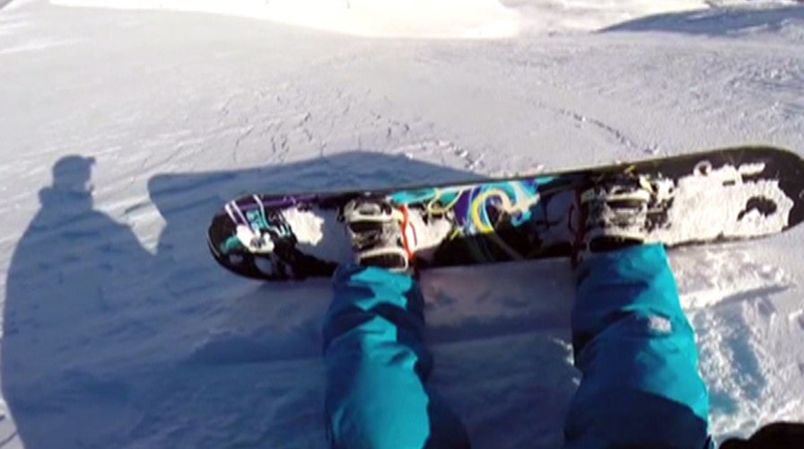 Snowboarder triggers avalanche, taken for wild ride