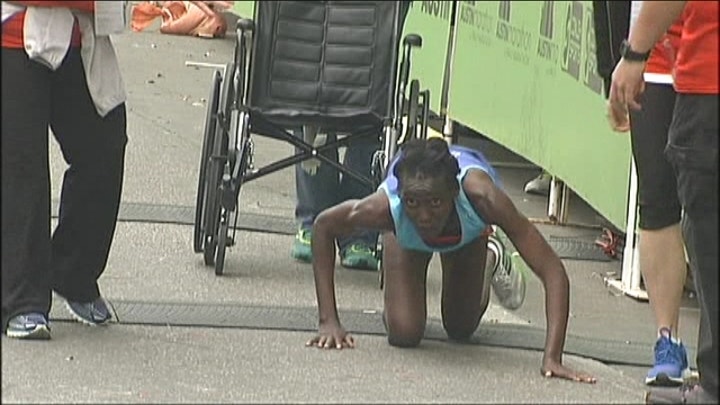 Woman crawls her way to third place in Austin Marathon