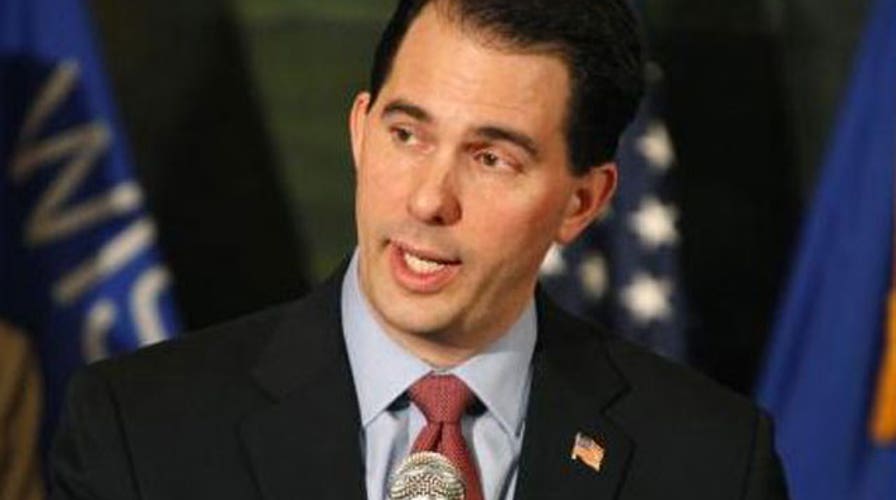 Scott Walker tries to talk himself out of trouble