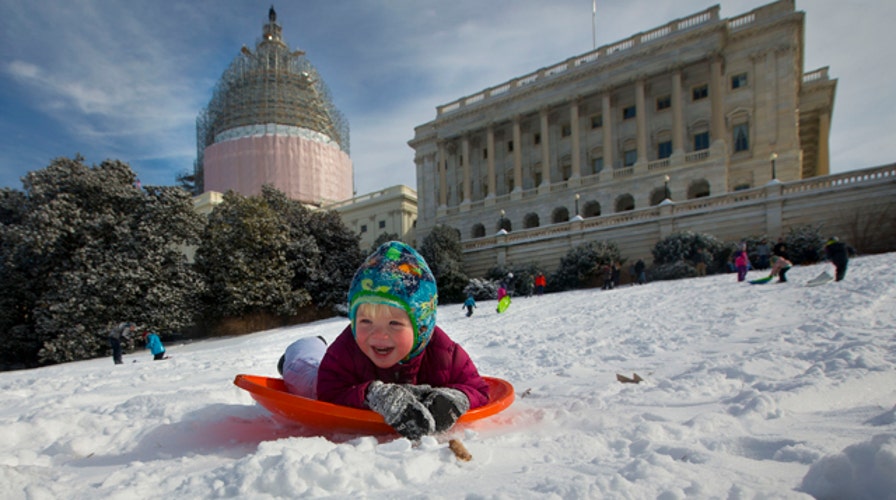 Sledding showdown on snowy Capitol Hill