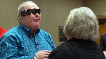 Man gets bionic eye, sees family for first time in 10 years