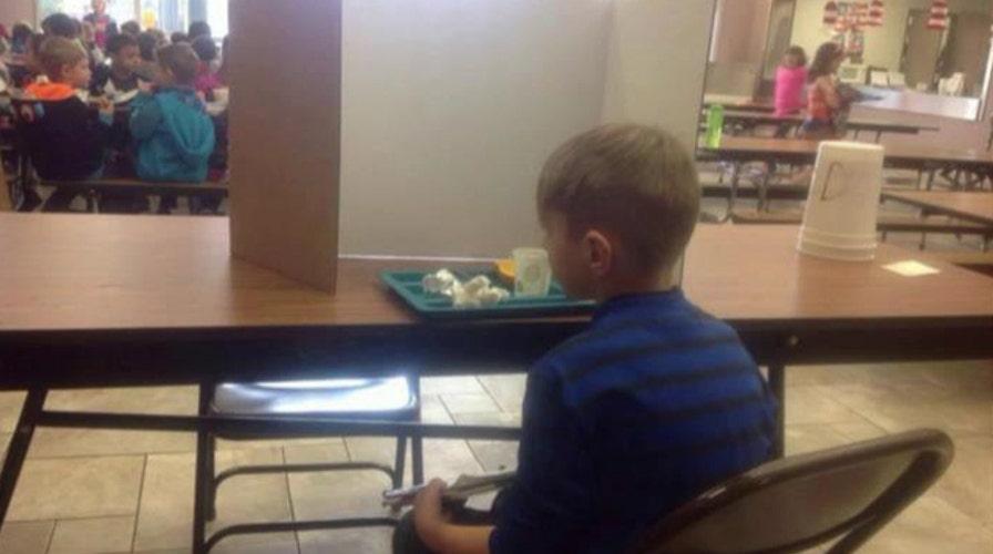 Tardy 1st grader forced to sit behind divider at lunchtime