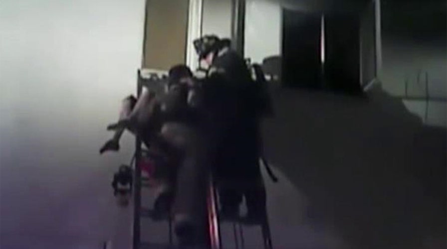 Body camera captures dramatic rescue from burning building