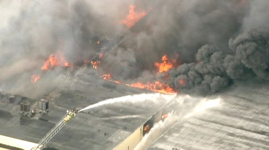 Major 4-alarm fire rages at Florida furniture warehouse