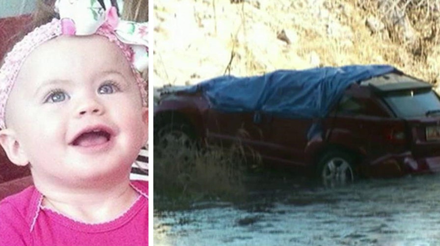 Cops: Baby survived crash, night trapped in car in river