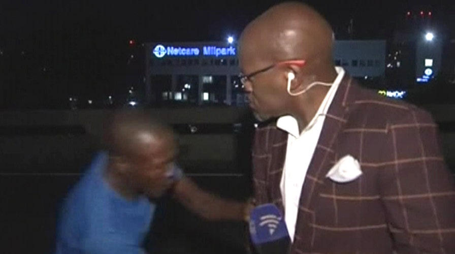 'We're being mugged': Reporter's robbery caught on camera