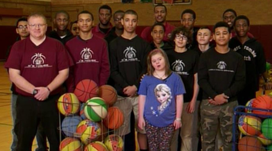Basketball team protects disabled cheerleader from bullies