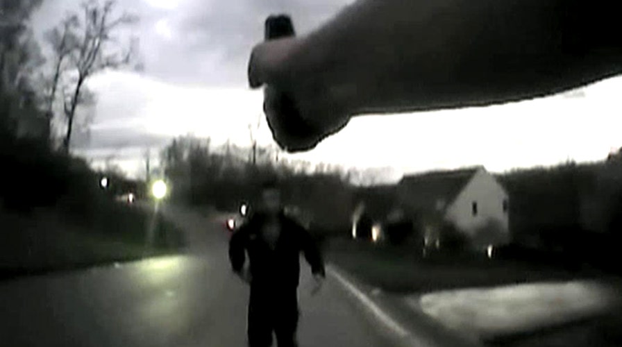 Cop praised for restraint in murder suspect's tense arrest