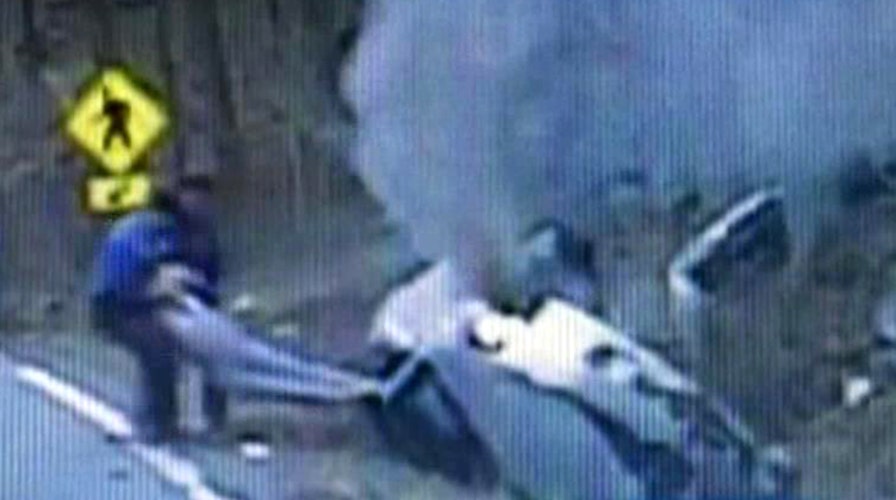 Hero cops save woman seconds before flames engulf car