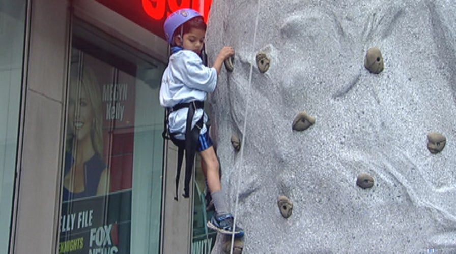 After the Show Show: Climbing the rock wall