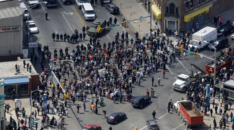Tensions running high as curfew looms in Baltimore