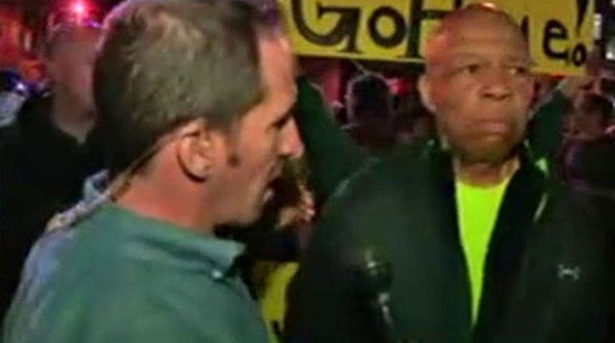 Congressman Elijah Cummings helps disperse protesters  