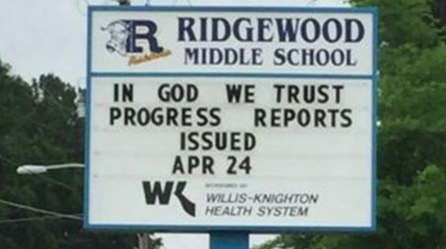Students stand up for 'In God We Trust' on school marquee
