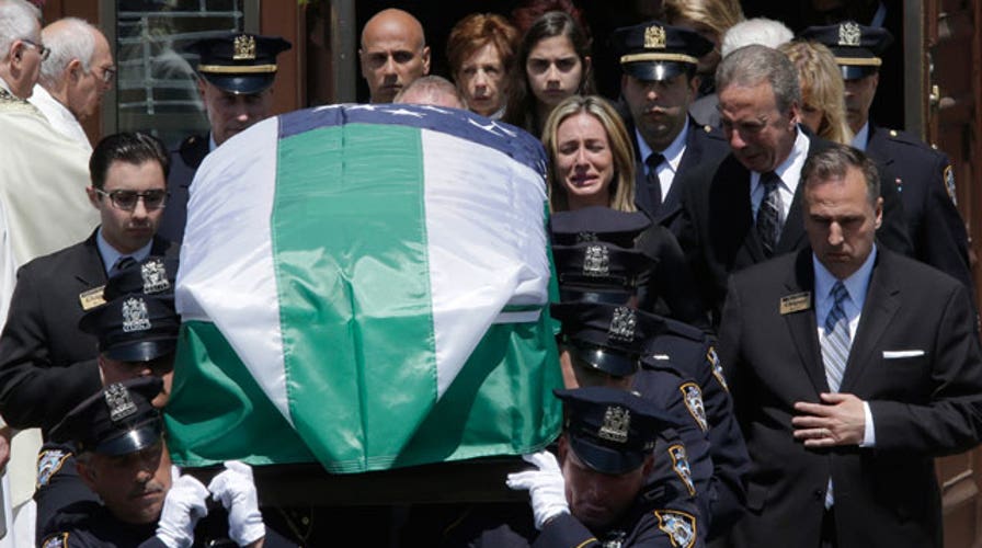 Thousands of cops gather for funeral of NYPD officer