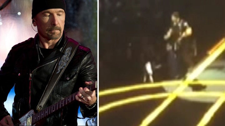 U2's The Edge topples off edge of stage during concert