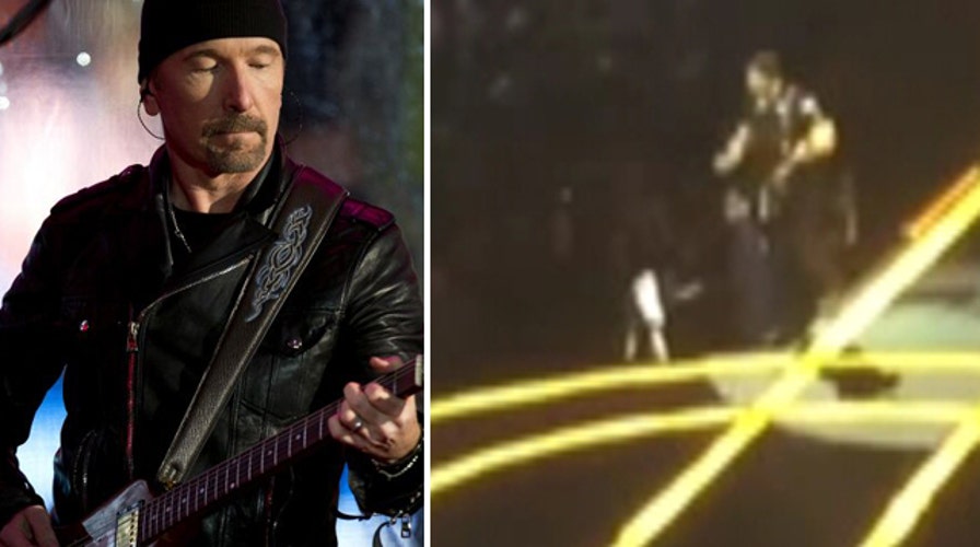 U2's The Edge topples off edge of stage during concert