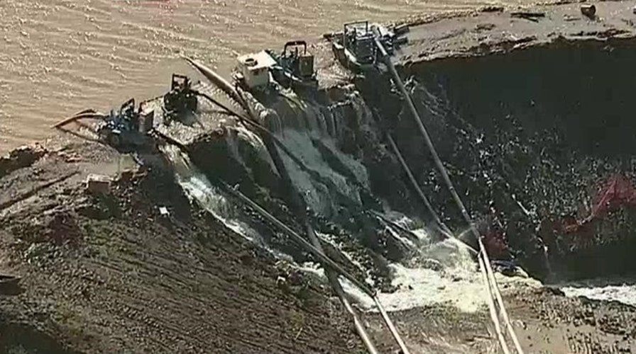 Dam breaches in Dallas suburb amid historic flooding