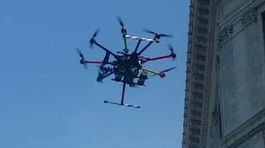 Mystery drone drops money on crowd in Michigan