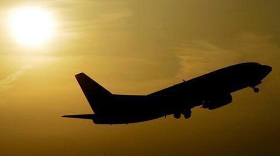 Raw video: Passengers on flight burst into song