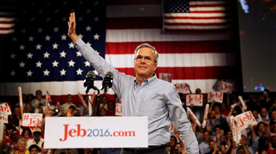 Bush standing on his record, not running from his name