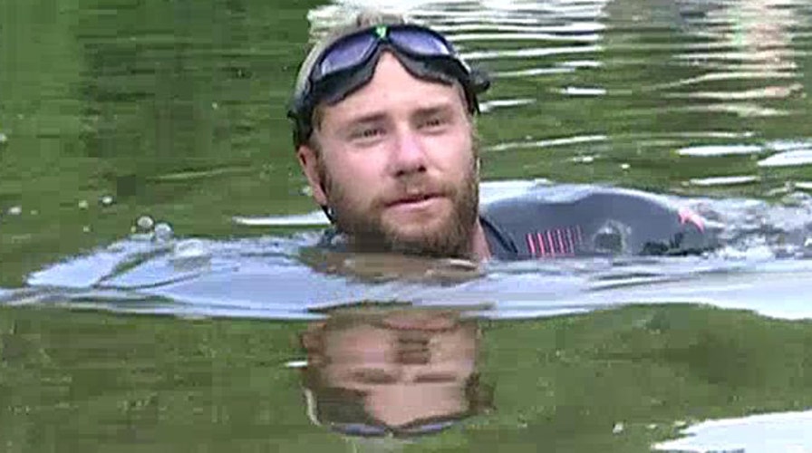Vet swims Mississippi River for families of fallen troops