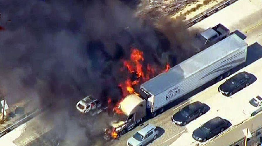 Brush fire engulfs California highway, sets cars ablaze