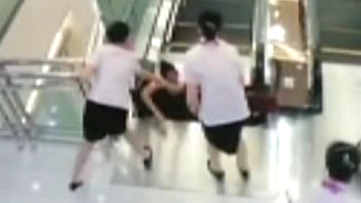 Woman saves son before dying in tragic escalator accident