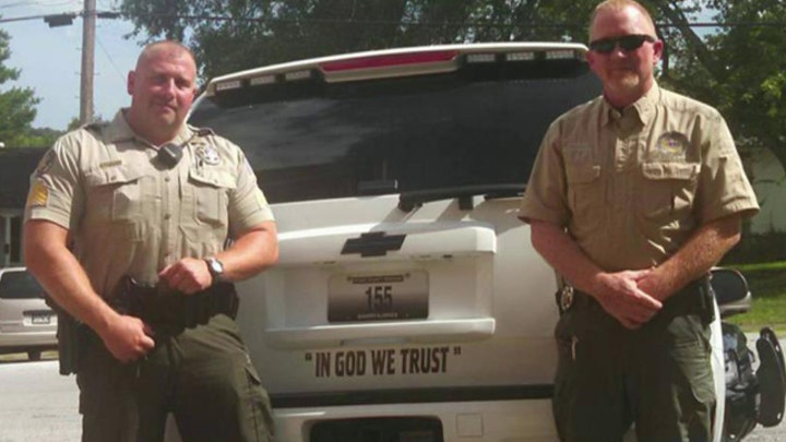 Atheists offended by sheriff's bumper-sticker salute