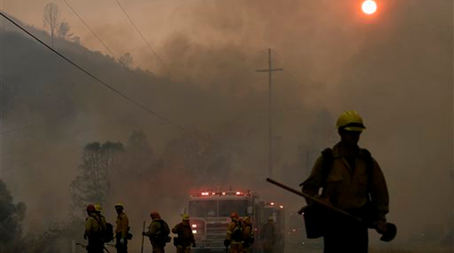 Over 8,000 firefighters battling over 20 wildfires in Calif.