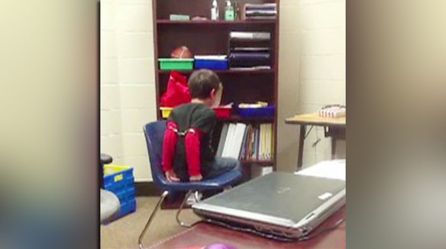 Controversy explodes over video of handcuffed 8-year-old