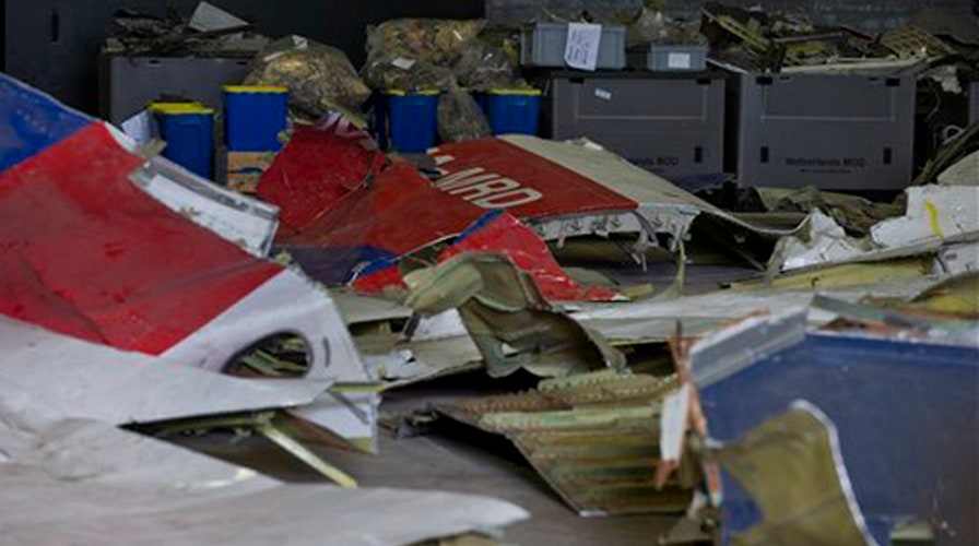 Dutch team examine possible missile parts at MH17 crash site