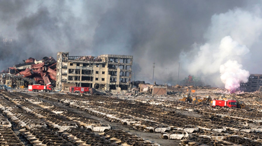 Deadly warehouse explosions kill dozens in China