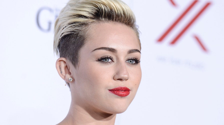 Raunchy Miley Cyrus shots building MTV buzz?
