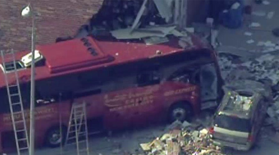 Bus crashes into building in Queens, New York