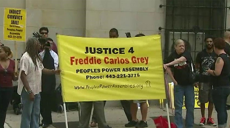Baltimore braces for protests as Freddie Gray hearing begins