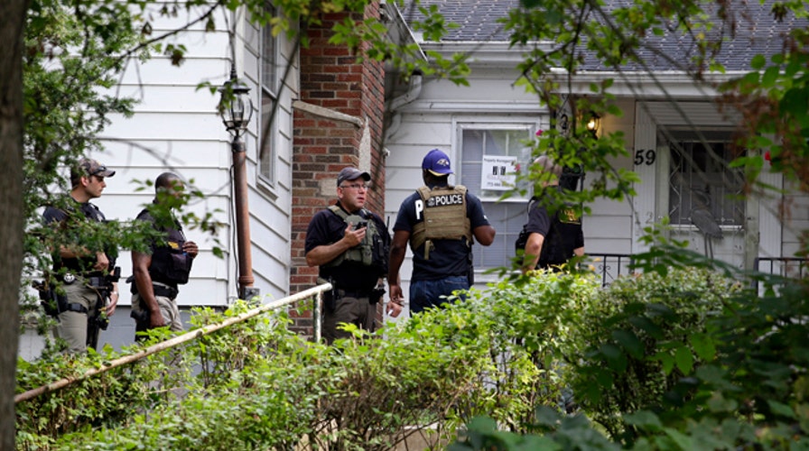 Police scour surveillance footage for clues in cop's death