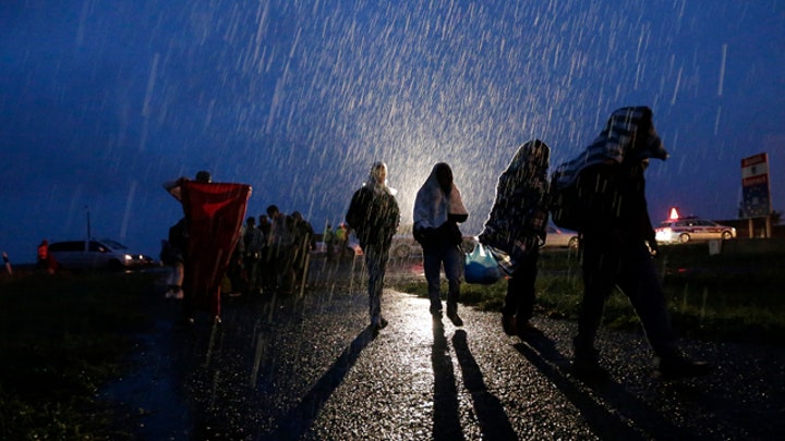 Thousands of refugees heading to Europe despite heavy rain