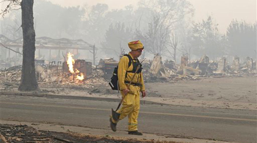 Fire Official: Wildfire has destroyed more than 100 homes