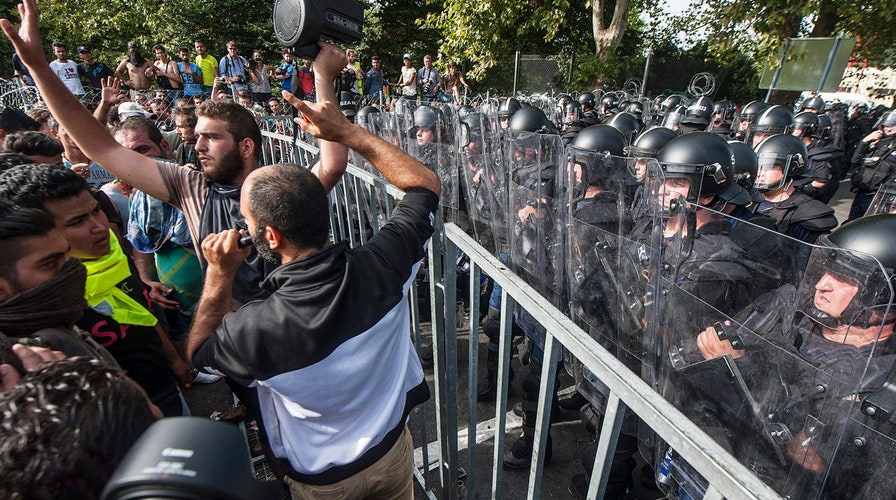 Hungary cracks down on migrants, blocks border entrance