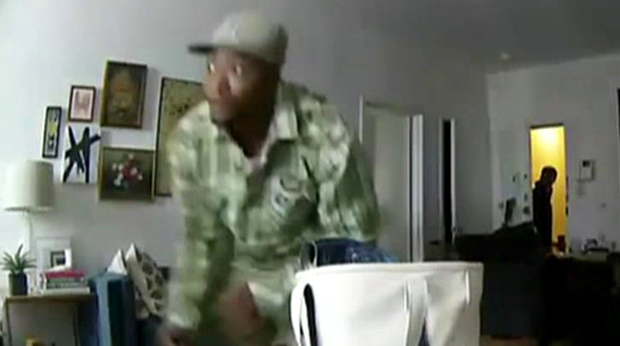 Man watches on his phone as burglars rob his apartment