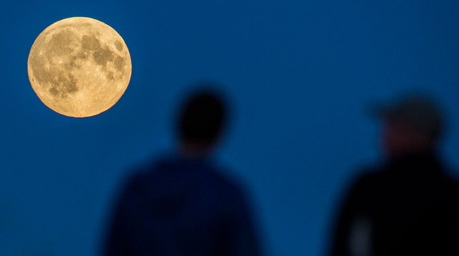 Lunar eclipse shares the sky with 'Super Moon'