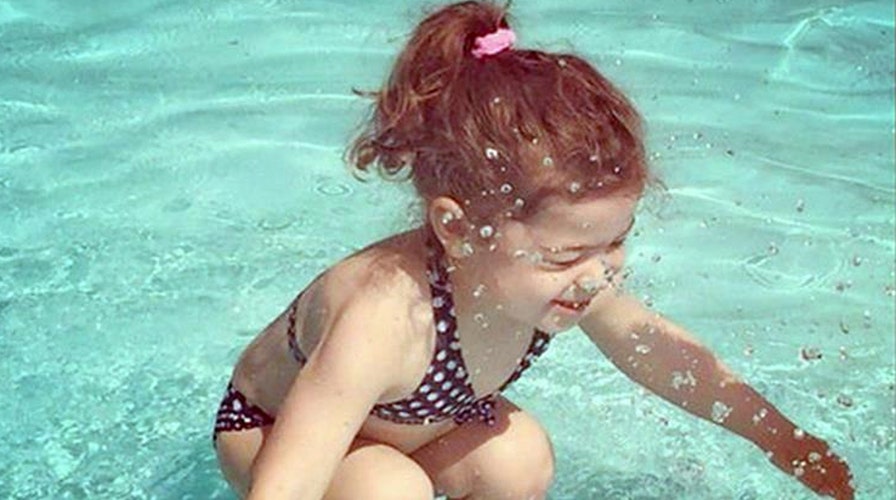 Puzzling picture: Is the girl in this photo underwater?